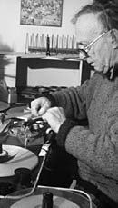 Filmmaker working at a Steenbeck film-editing deck.