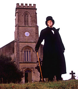 "Evolution" scene Actor in top hat in front of church, from "Evolution"