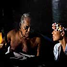 Mau Piailug and Elizabeth Lindsey talk by lantern light