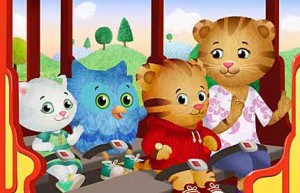 Daniel Tiger rides Trolley with his mom (right) and friends Katerina Kittycat and O the Owl in the new series Daniel Tiger’s Neighborhood,set to debut on PBS Kids in fall 2012. (Image copyright 2011 by The Fred Rogers Co.)