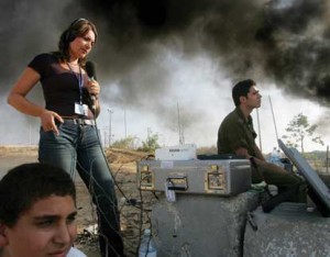 KCET will pick up distribution of BBC World News to pubTV stations while WNET/WLIW develops a competing nightly newscast. Pictured: BBC correspondent Katya Adler reports from the Gaza Strip. (Photo: BBC.)