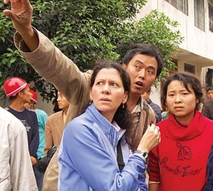 Plans for a week's broadcasts from China changed May 12. Pictured: NPR's Melissa Block interviews residents of Dujiangyan after the quake. (Photo: Andrea Hsu, NPR.)