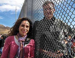 The Mexican border reliably generates news while complicating coverage. Fronteras reporter Mónica Ortiz Uribe and NPR colleague John Burnett meet at the fence between Sunland Park, N.M., and Ciudad Juárez, Mexico.