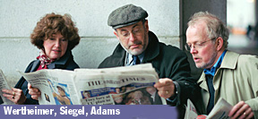 Wertheimer, Siegel and Adams posing as if they're reading newspapers, of all things
