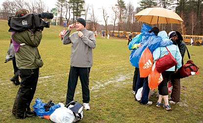 Runners huddle in the rain before starting the marathon, April 2007